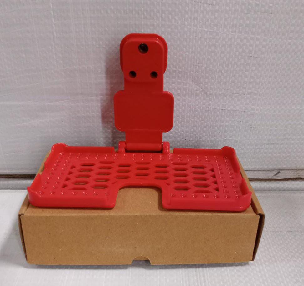 Multi-purpose wall holder in red. Multi-purpose wall holder in red.